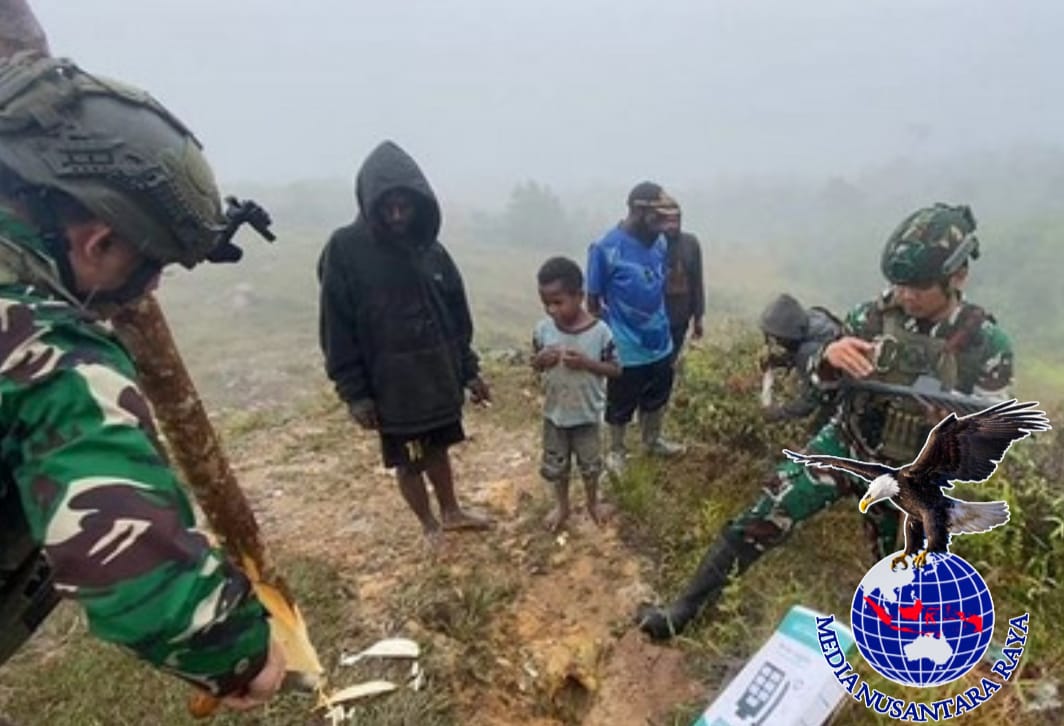 Satgas Yonif Raider 432/Waspada Setia Jaya Kostrad Laksanakan Kegiatan Pemasangan Lampu Solar Cell Terangi Yigi