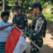 Sambut HUT RI ke-80, Satgas Yonif 763/SBA Bagikan Bendera Merah Putih di Wilayah Warga Binaan