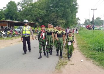 Polsek Mempawah Hulu Laksanakan Pengamanan pertandingan Lomba Gerak jalan.