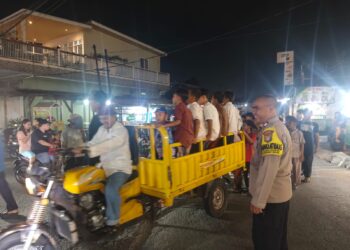 JAGA JAKARTA JAGA BEKASI, Bhabinkamtibmas Cikarang Barat Amankan Pawai Tahun Baru Islam 1448 H di Telaga Murni