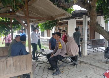 Polsek Tambun Selatan Dampingi Pendataan Bangunan untuk Rencana Pengendalian Banjir Kali Bekasi di Sriamur
