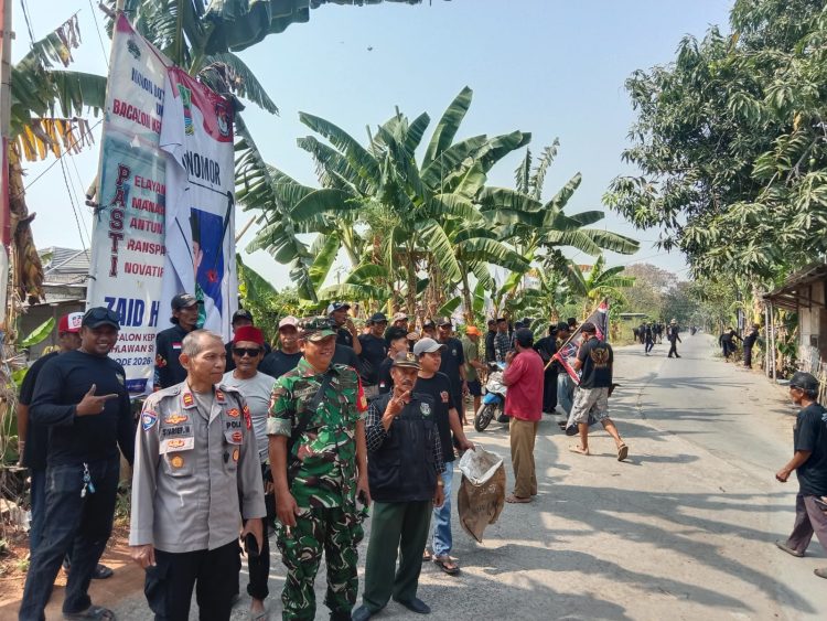 Polsek Tarumajaya Amankan Kampanye Calon Kades Pahlawan Setia Nomor Urut 2